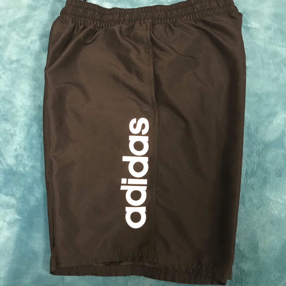 Black adidas swim trunks with pockets